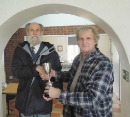 Mike Beeby receiving the Steam Plough Cup from Chairman Mark Jones in 2019.