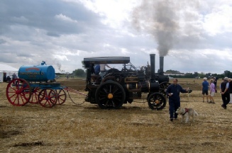 Fowler Tractor 14805 with a Fowler 4 wheel water cart on duty