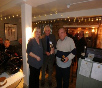 Richard Pierce and Peter Stanier receive their award and The Gold Medal from Sue Frith